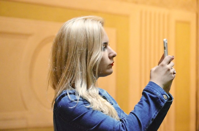 Blonde woman with cell-phone